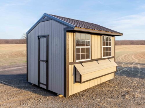a chicken coop in a field